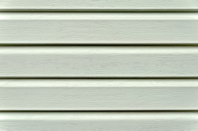 The texture of bright green plastic siding
